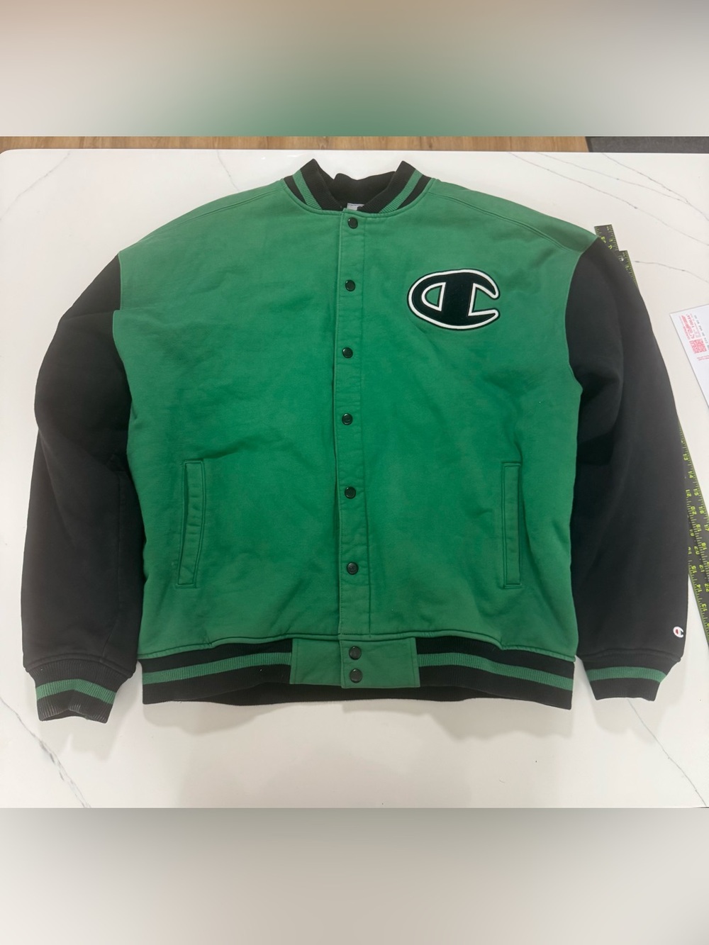 Champion varsity jacket in green and black with large embroidered chest patch